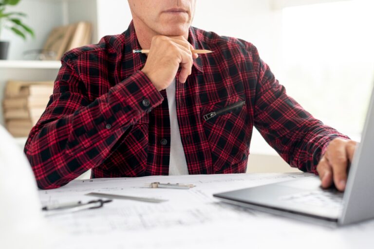 man-looking-architectural-project-laptop_23-2148242942